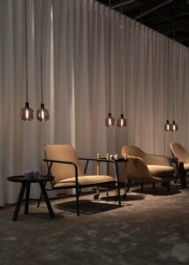 brown padded armchair with black steel frame