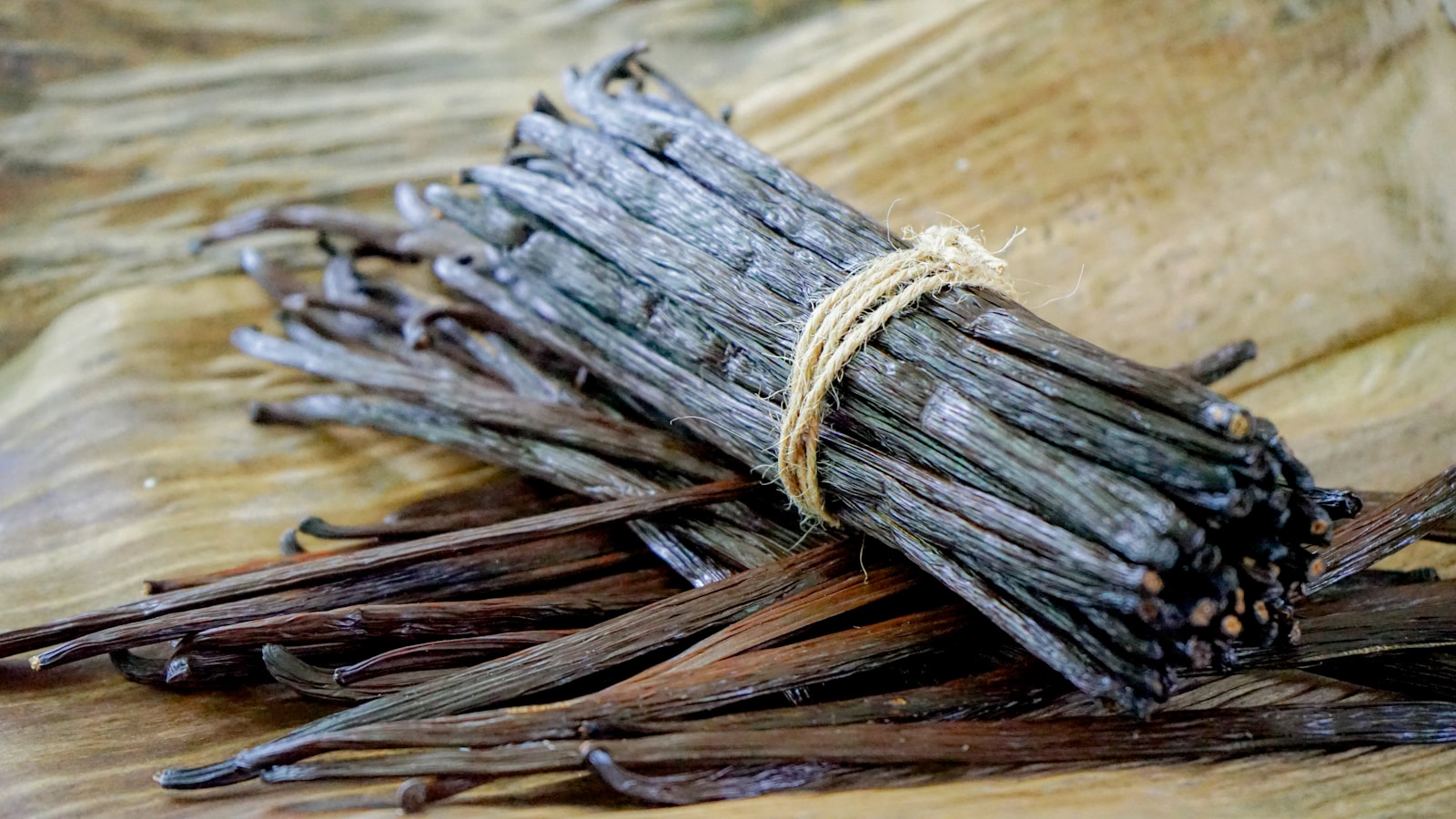 a bundle of sticks sitting on top of a wooden table